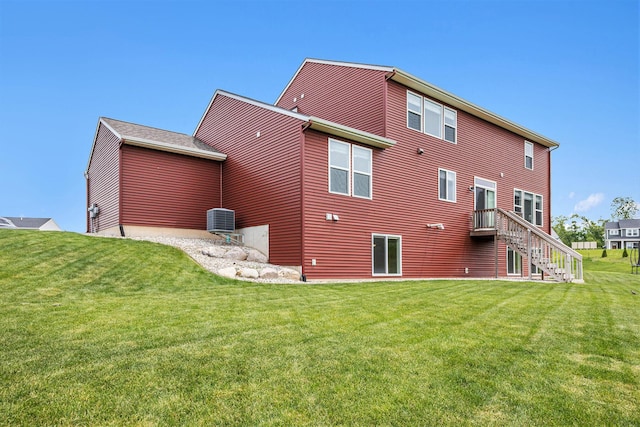 1162 Cooks Corner Ct SE, Byron Center, MI 49315 - rear view of property featuring a yard, central air condition unit, and stairs