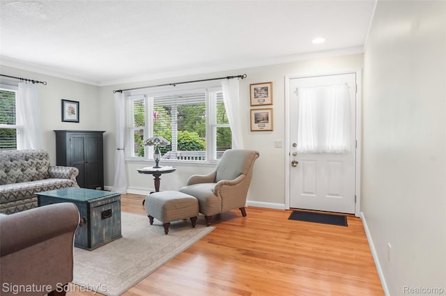 300 Cornell St, Howell, MI 48843 - living room with baseboards, light wood-type flooring, crown molding, and recessed lighting