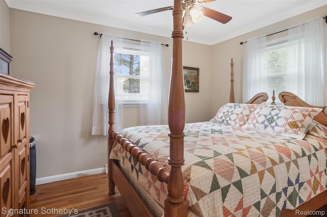 300 Cornell St, Howell, MI 48843 - bedroom with wood finished floors, baseboards, and ceiling fan