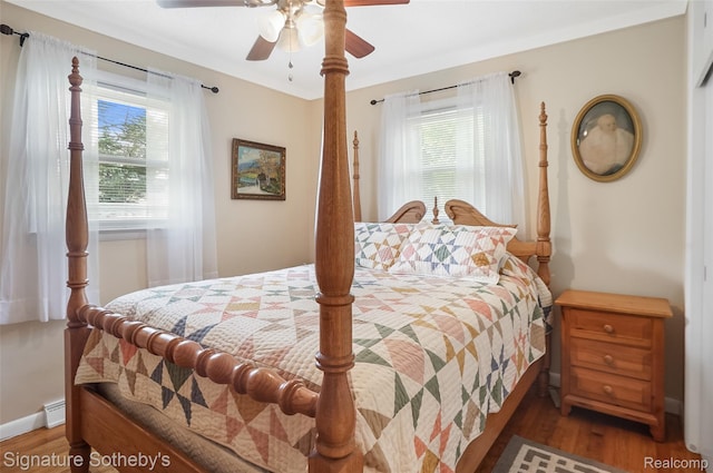 300 Cornell St, Howell, MI 48843 - bedroom featuring multiple windows, wood finished floors, and ceiling fan