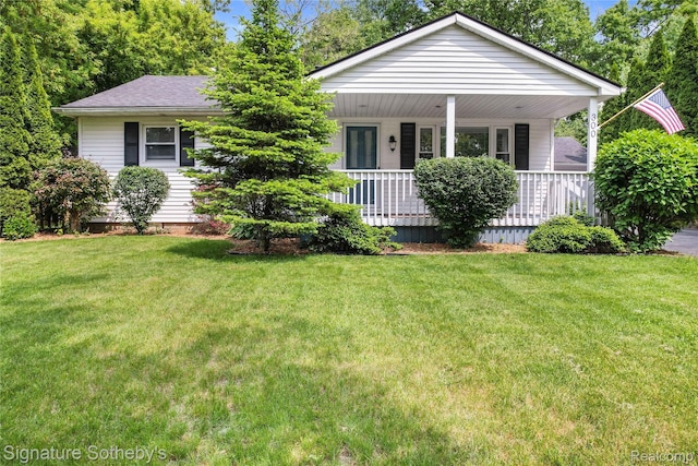 300 Cornell St, Howell, MI 48843 - view of front of property with a front lawn and a porch