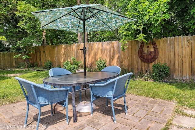 300 Cornell St, Howell, MI 48843 - fenced backyard featuring a patio and outdoor dining area