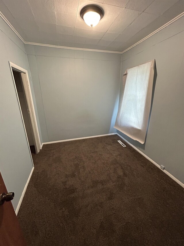 1015 Alvord Ave, Flint, MI 48507 - unfurnished room with crown molding, carpet, and baseboards