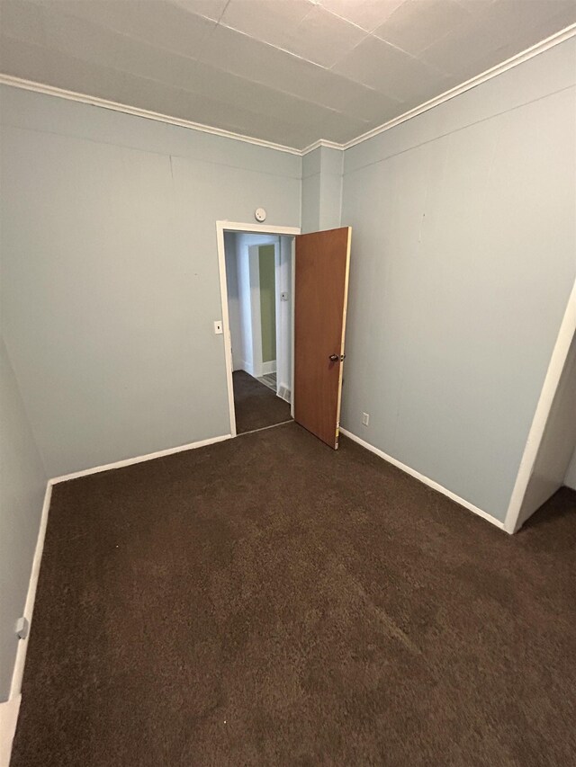 1015 Alvord Ave, Flint, MI 48507 - unfurnished room featuring dark carpet and baseboards