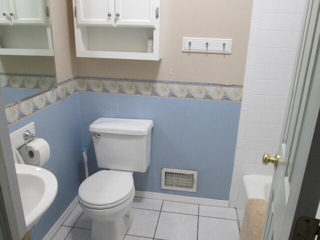 6005 Saint Joseph Ave, Stevensville, MI 49127 - bathroom with tile patterned flooring and toilet