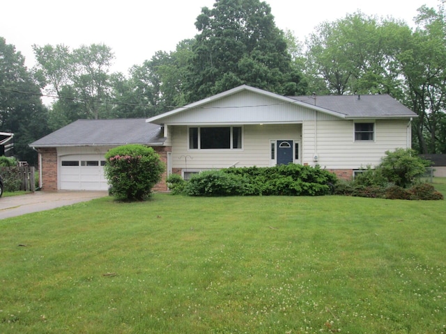6005 Saint Joseph Ave, Stevensville, MI 49127 - tri-level home featuring a garage, a front yard, and concrete driveway