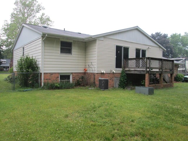 6005 Saint Joseph Ave, Stevensville, MI 49127 - back of property featuring a wooden deck and central AC