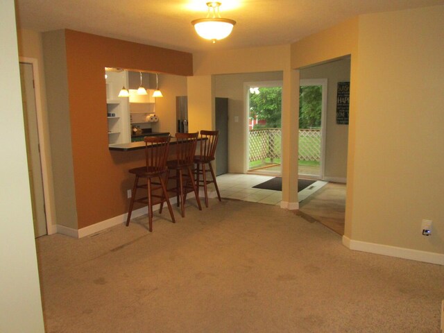 6005 Saint Joseph Ave, Stevensville, MI 49127 - dining area with carpet floors and baseboards