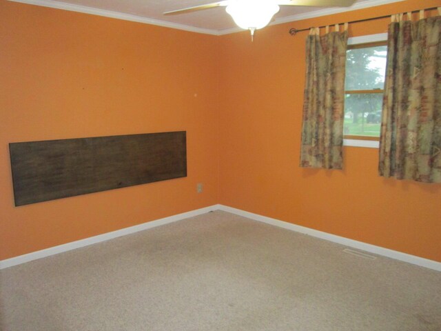 6005 Saint Joseph Ave, Stevensville, MI 49127 - carpeted empty room featuring ornamental molding, a ceiling fan, and baseboards