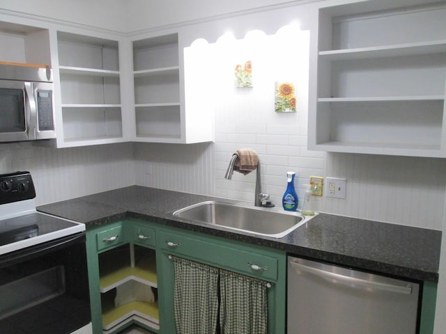 6005 Saint Joseph Ave, Stevensville, MI 49127 - kitchen featuring open shelves, stainless steel appliances, green cabinetry, a sink, and tasteful backsplash