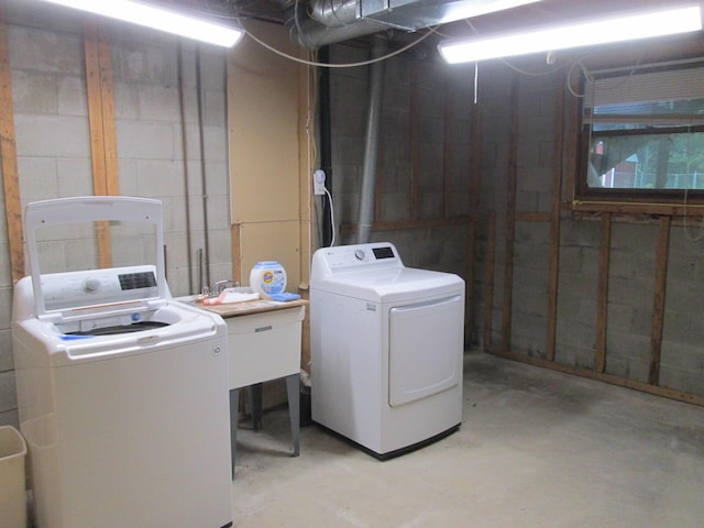 6005 Saint Joseph Ave, Stevensville, MI 49127 - laundry area featuring separate washer and dryer and concrete block wall
