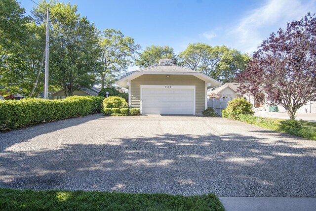 2585 Memorial Dr, Muskegon, MI 49445 - view of side of home with driveway and an attached garage
