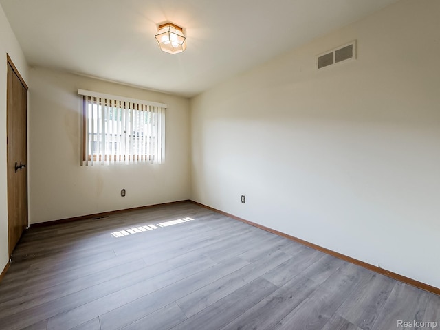 3849 Barg Dr, Warren, MI 48310 - empty room with wood finished floors and baseboards