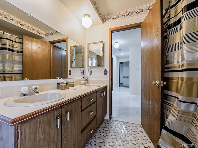 3849 Barg Dr, Warren, MI 48310 - bathroom with double vanity and baseboards