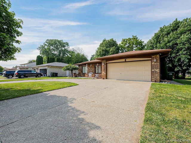 3849 Barg Dr, Warren, MI 48310 - view of front of home with driveway, a front lawn, a garage, and brick siding