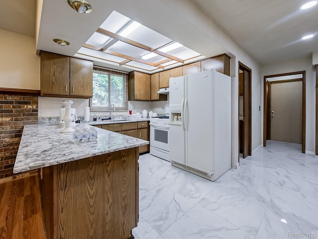 3849 Barg Dr, Warren, MI 48310 - kitchen with white appliances, a peninsula, a sink, ventilation hood, and light marble finish flooring