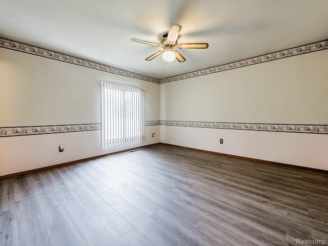 3849 Barg Dr, Warren, MI 48310 - empty room with a ceiling fan, wood finished floors, and baseboards