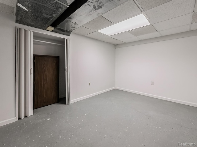 3849 Barg Dr, Warren, MI 48310 - basement with baseboards and a paneled ceiling