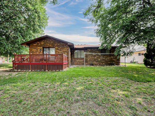 3849 Barg Dr, Warren, MI 48310 - rear view of property with brick siding, a deck, and a yard