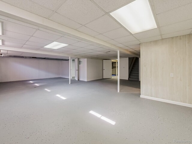 3849 Barg Dr, Warren, MI 48310 - finished below grade area featuring stairway, a drop ceiling, and baseboards
