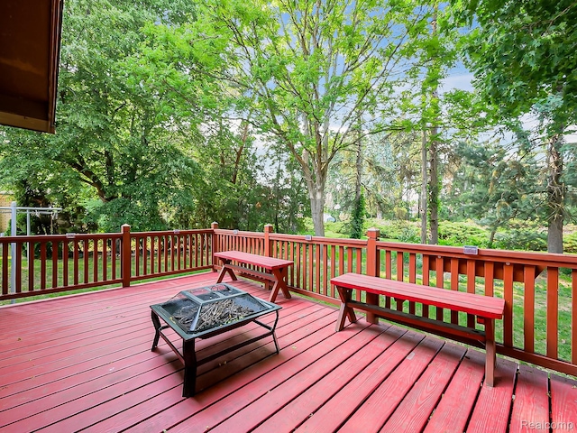 3849 Barg Dr, Warren, MI 48310 - wooden deck with a fire pit
