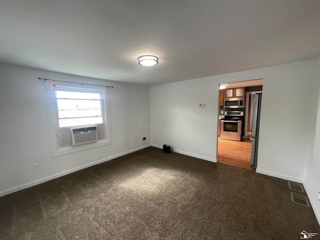 6301 E Albain Rd, Monroe, MI 48161 - empty room with dark colored carpet, baseboards, and cooling unit