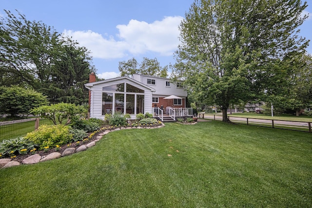 489 Old Creek Ct, Saline, MI 48176 - rear view of house featuring a chimney and a deck