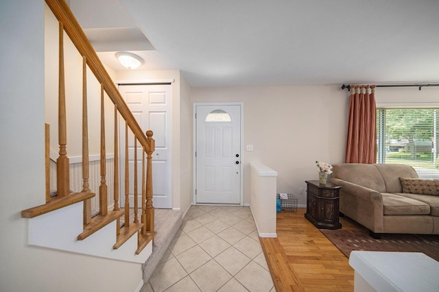 489 Old Creek Ct, Saline, MI 48176 - entrance foyer featuring stairway, baseboards, and light tile patterned floors