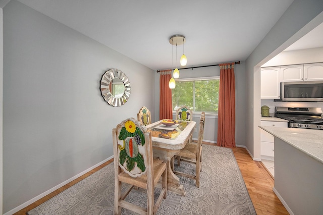 489 Old Creek Ct, Saline, MI 48176 - dining room with light wood finished floors and baseboards