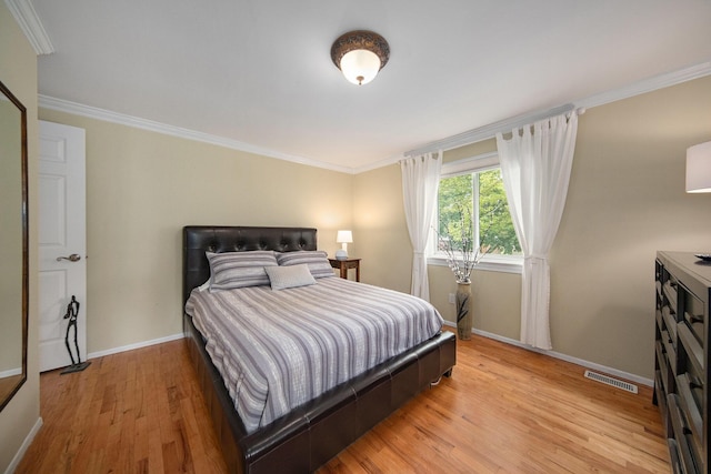489 Old Creek Ct, Saline, MI 48176 - bedroom featuring baseboards, light wood-style floors, and ornamental molding