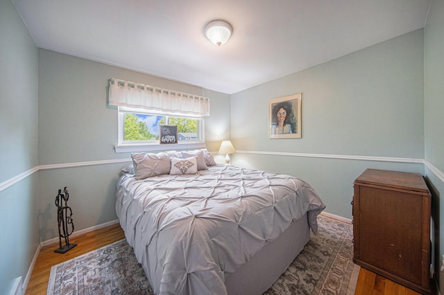489 Old Creek Ct, Saline, MI 48176 - bedroom featuring wood finished floors and baseboards