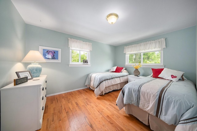 489 Old Creek Ct, Saline, MI 48176 - bedroom featuring light wood finished floors and baseboards