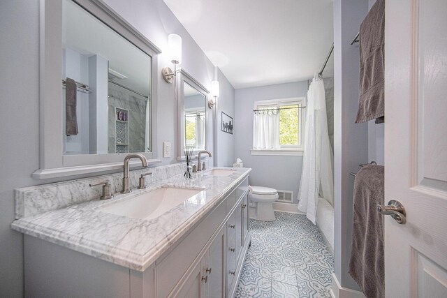 489 Old Creek Ct, Saline, MI 48176 - bathroom with double vanity, toilet, tile patterned flooring, shower / bath combo, and baseboards