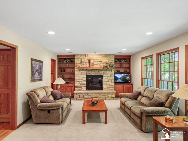 9241 Legacy Ct, Temperance, MI 48182 - living area featuring built in features, recessed lighting, a fireplace, and baseboards