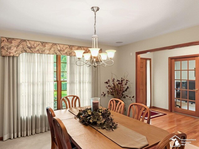 9241 Legacy Ct, Temperance, MI 48182 - dining area featuring a chandelier