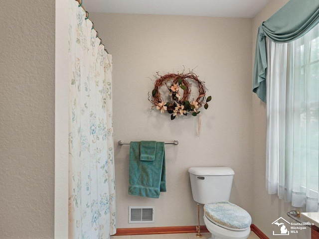 9241 Legacy Ct, Temperance, MI 48182 - full bath with toilet and baseboards
