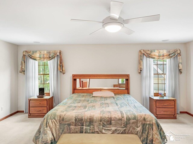 9241 Legacy Ct, Temperance, MI 48182 - carpeted bedroom with baseboards and a ceiling fan