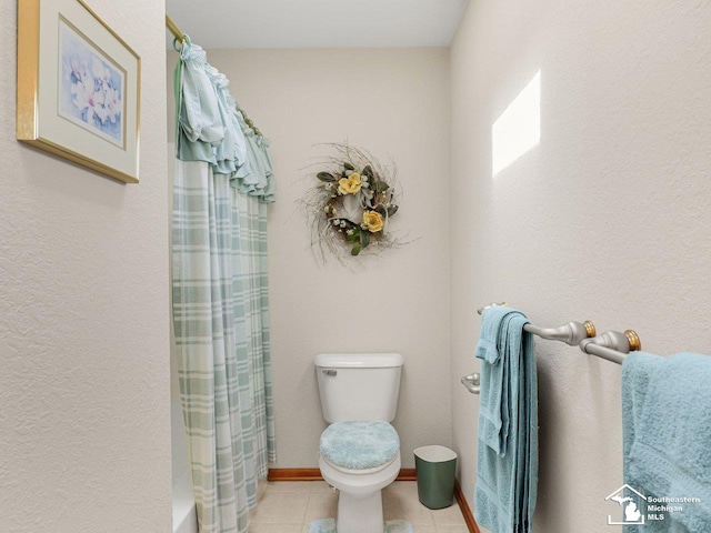 9241 Legacy Ct, Temperance, MI 48182 - full bathroom featuring toilet, tile patterned floors, and baseboards
