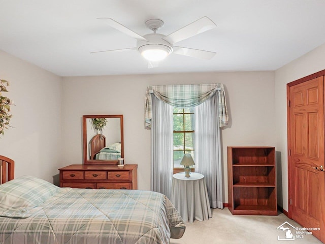 9241 Legacy Ct, Temperance, MI 48182 - bedroom with light colored carpet and ceiling fan