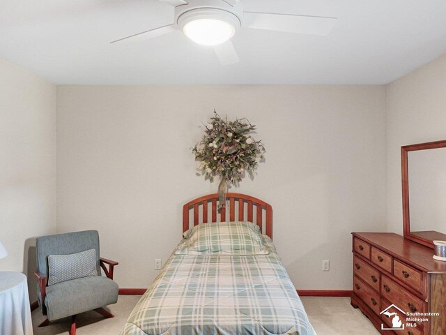 9241 Legacy Ct, Temperance, MI 48182 - bedroom featuring light carpet, baseboards, and a ceiling fan