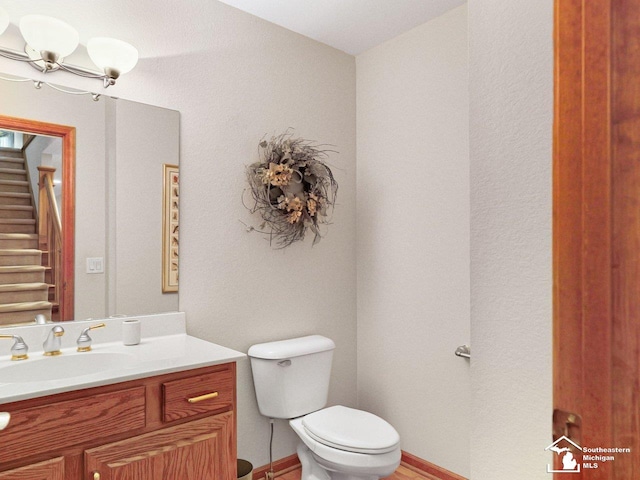 9241 Legacy Ct, Temperance, MI 48182 - half bath featuring toilet, vanity, and a towel warmer