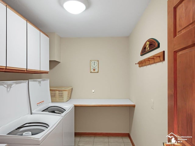 9241 Legacy Ct, Temperance, MI 48182 - laundry area featuring cabinet space, washer and clothes dryer, baseboards, and light tile patterned flooring