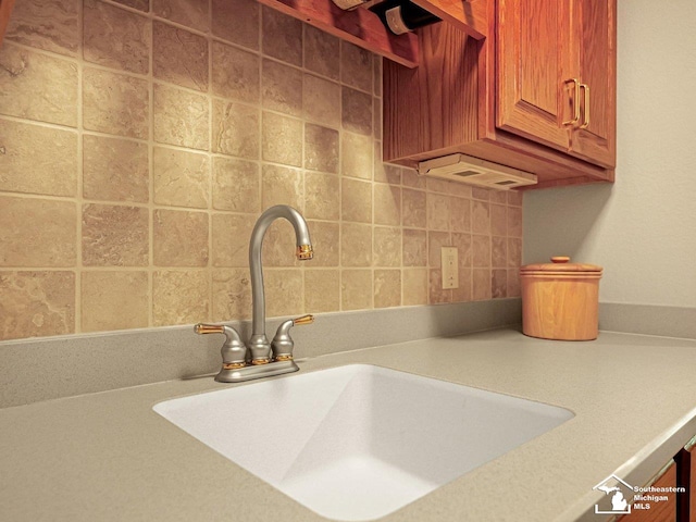 9241 Legacy Ct, Temperance, MI 48182 - detailed view of a sink, light countertops, and backsplash