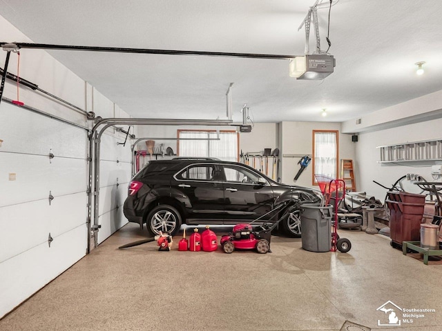 9241 Legacy Ct, Temperance, MI 48182 - garage featuring a garage door opener