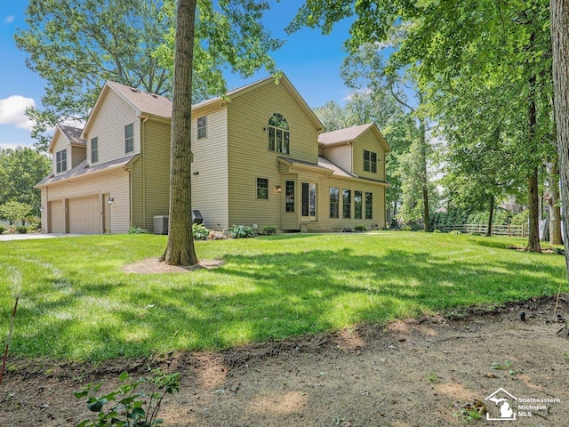 9241 Legacy Ct, Temperance, MI 48182 - view of side of property with a garage and central air condition unit