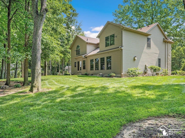 9241 Legacy Ct, Temperance, MI 48182 - back of property with a yard