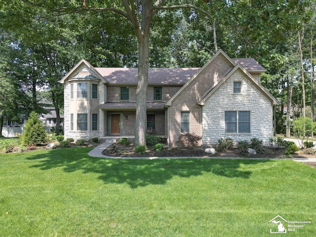 9241 Legacy Ct, Temperance, MI 48182 - view of front of house with stone siding and a front lawn