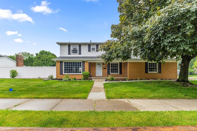18607 Colonial Ct, Allen Park, MI 48101 - traditional-style house featuring brick siding and covered porch