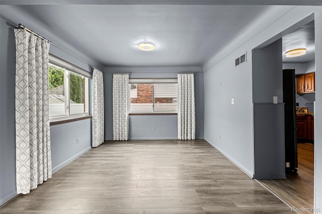 18607 Colonial Ct, Allen Park, MI 48101 - empty room featuring wood finished floors and baseboards