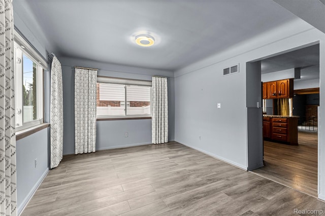 18607 Colonial Ct, Allen Park, MI 48101 - unfurnished room featuring light wood-style floors and baseboards